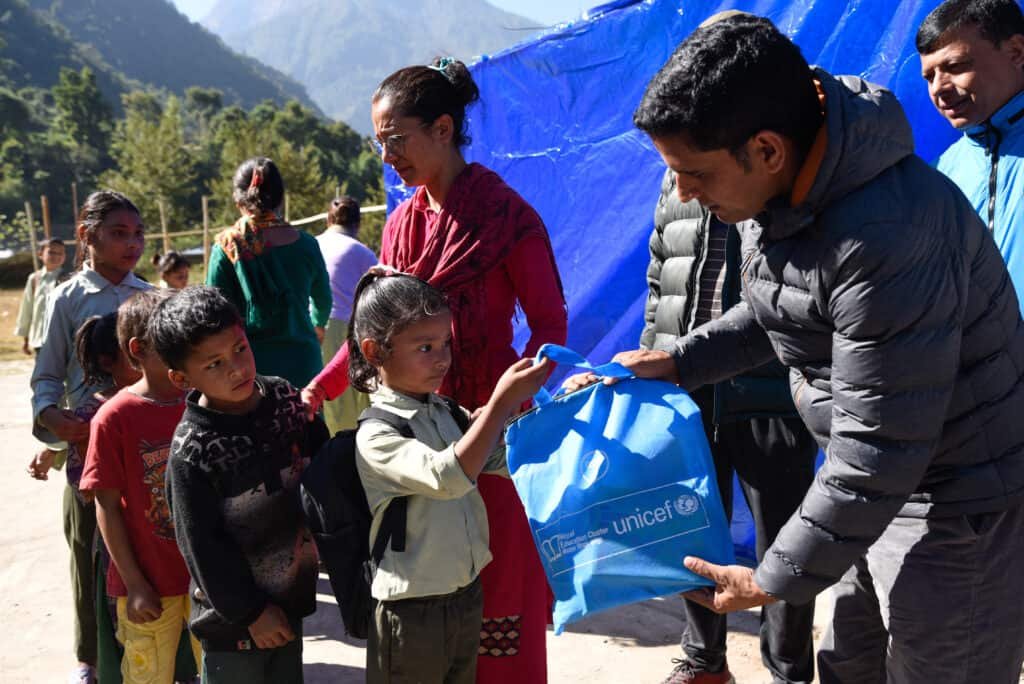 On 20 November 2023, children at the Shree Nepal Rashtriya School in Aathbiskot, Rukum West District, receive learning kits supported by UNICEF, as a Temporary Learning Centre (TLC) is installed on the premises.  

To ensure that children’s right to learn stays uninterrupted even in the midst of disaster, UNICEF is supporting the setting up of over 200 TLCs across 102 schools in earthquake-affected Jajarkot and Rukum West Districts. 

The 6.4 magnitude earthquake that hit western Nepal on 3 November has significantly impacted school buildings and classrooms, affecting the learning of an estimated 125,000 school-aged children. Apart from establishing TLCs, UNICEF is also distributing Early Childhood Development kits, and other school and student kits, comprising a variety of age-appropriate learning materials. 

To learn more about the situation on the ground and UNICEF’s continuing response efforts, visit https://uni.cf/3ubpLVN