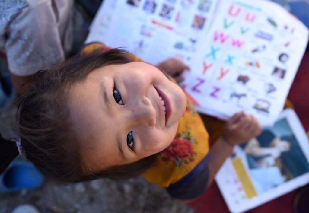 On 20 November 2023, at the Shree Jumledhara Basic School in Aathbiskot, Rukum West District, children sit outside for their morning class, as a Temporary Learning Centre (TLC) is set up behind them.  

To ensure that children’s right to learn stays uninterrupted even in the midst of disaster, UNICEF is supporting the setting up of over 200 TLCs across 102 schools in earthquake-affected Jajarkot and Rukum West Districts. 

The 6.4 magnitude earthquake that hit western Nepal on 3 November has significantly impacted school buildings and classrooms, affecting the learning of an estimated 125,000 school-aged children. Apart from establishing TLCs, UNICEF is also distributing Early Childhood Development kits, and other school and student kits, comprising a variety of age-appropriate learning materials. 

To learn more about the situation on the ground and UNICEF’s continuing response efforts, visit https://uni.cf/3ubpLVN