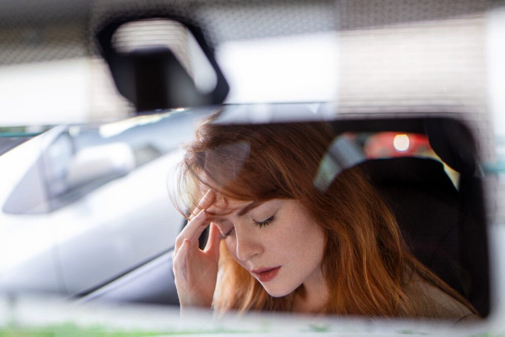 beautiful upset woman sitting automobile crying breakup sadness